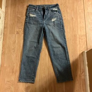 AE Highrise Mom Straight jeans. Stretch in waist otherwise rigid.